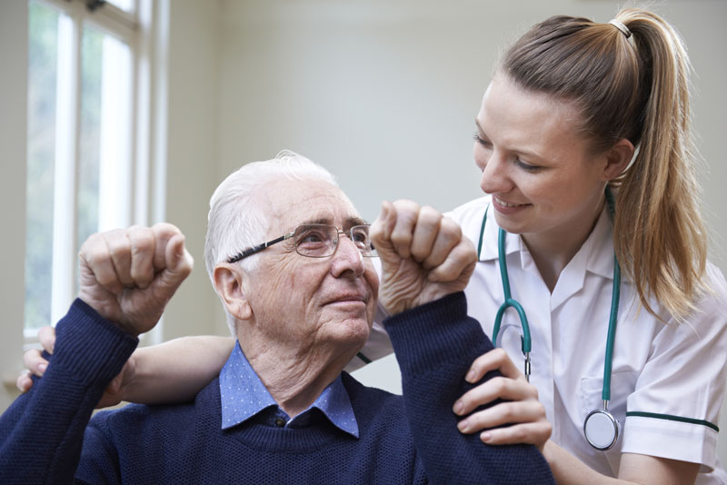 Man with physical therapist